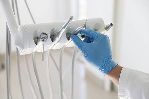 Professional Tooth Extraction technician working in Louisville, NE